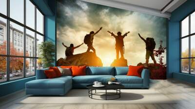 Celebrating life of Hikers climbing up mountain cliff. Climbing group helping each other while climbing up in sunset. Concept of help and teamwork, Limits of life and Hiking success full. Wall mural