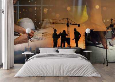 Double exposure of civil engineer silhouette at construction site with building designer working and meeting at night in banner site Wall mural