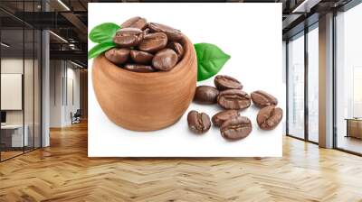 Heap of roasted coffee beans in wooden bowl with leaves isolated on white background with clipping path and full depth of field. Wall mural