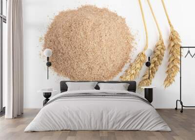 Pile of wheat bran with ears isolated on white background Wall mural