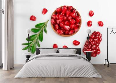 pomegranate seeds in wooden bowl isolated on white background with clipping path and full depth of field. Top view. Flat lay. Wall mural