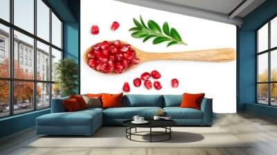 pomegranate seeds in wooden spoon isolated on white background with clipping path and full depth of field. Top view. Flat lay. Wall mural