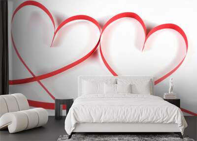 Two hearts made of red paper ribbon isolated on white background Wall mural