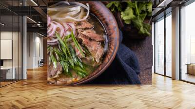 Pho Bo Vietnamese fresh rice noodle soup with beef, onions, lime, herbs and chili. Asian cuisine. Wall mural