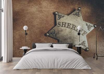 sheriff badge on brown leather texture background. macro shot. Wall mural