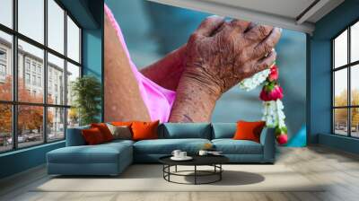 Thai Songkran festival,  elder hand with jasmin garland Wall mural