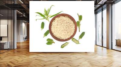 Top view of white sesame seeds in wooden bowl isolated on white background Wall mural