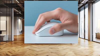 Close-up of a woman's hand clicking a mouse on a laptop in a modern office Wall mural