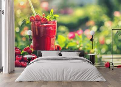 Raspberry smoothie served in blossoming garden, healthy refreshing summer drink Wall mural