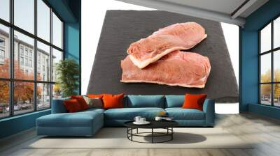 Two raw duck breast fillets on black slate plate, isolated on white Wall mural