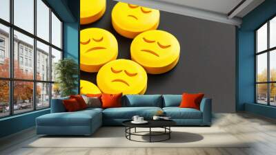 Yellow medicine pills with sad emoticons - concept of drug adverse effects Wall mural