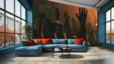 Hands silhouettes of the crowd raised up at music show.  Wall mural