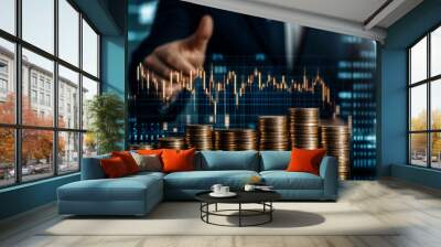 Businessman giving thumbs up behind stacks of coins with financial stock market graph, concept of investment and economic growth. Wall mural