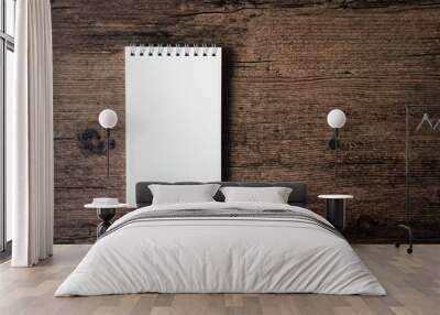 Top view image of open notebook with blank page on the wooden table.. Wall mural