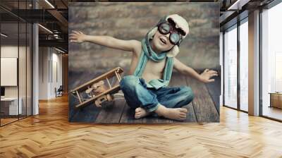 A small boy playing Wall mural