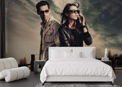 Attractive young couple wearing sunglasses Wall mural