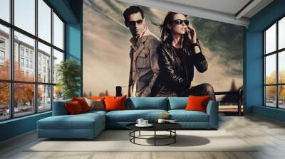 attractive young couple wearing sunglasses Wall mural