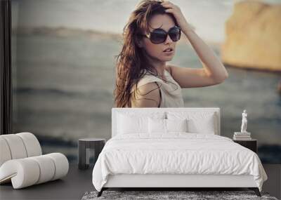 Cute woman wearing sunglasses Wall mural