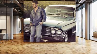 Elegant male model with the retro car Wall mural