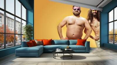 Funny portrait of two antagonist friends on vacation Wall mural