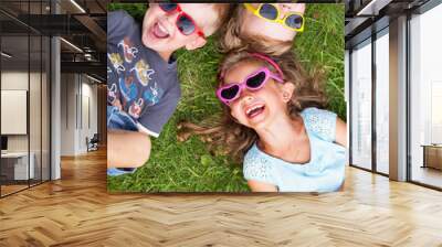 laughing kids relaxing during summer day Wall mural