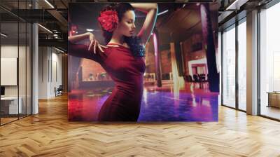 Portrait of a dancing brunette woman Wall mural