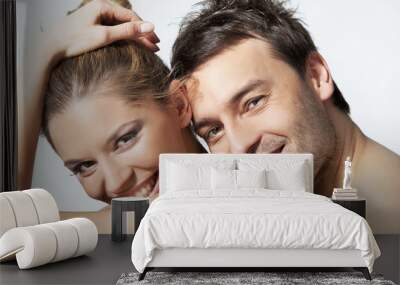 Portrait of happy young woman and man smiling together Wall mural