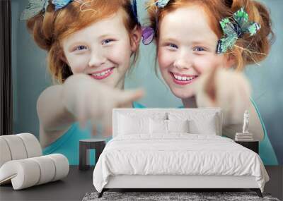 Portrait of two cheerful redhead twins Wall mural