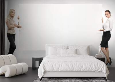 two businesswomen showing an empty board, Wall mural