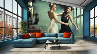 Two female beauties in a dancing pose Wall mural