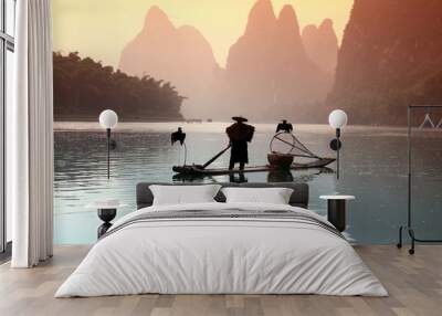 Chinese man fishing with cormorants birds Wall mural