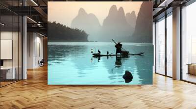 Chinese man fishing with cormorants birds Wall mural