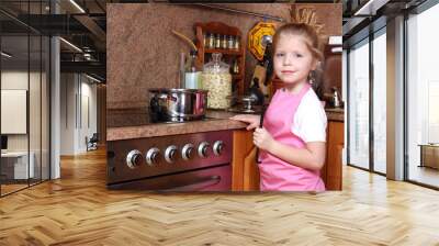 Little girl cooking in the kitchen Wall mural