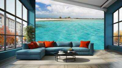 Soft wave of the sea on the sandy beach. Blue sky, white sand and place for text. Cuba, Caribbean sea. Wall mural