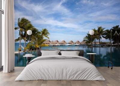 The pool under palm trees on the seashore.Polynesia, Tahiti Wall mural