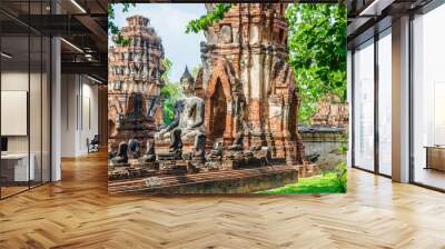 only intact ancient buddha statue among the destroyed statues in ayutthaya historical park, thailand Wall mural