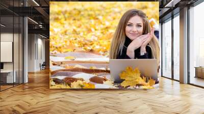 young blond woman in autumn Park Wall mural