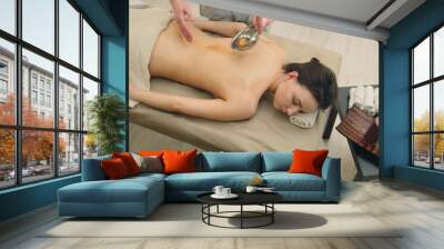 Classic oil massage in the spa salon - relaxation therapy for attractive young woman Wall mural