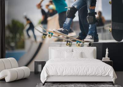 two skateboarders performing tricks simultaneously. Wall mural