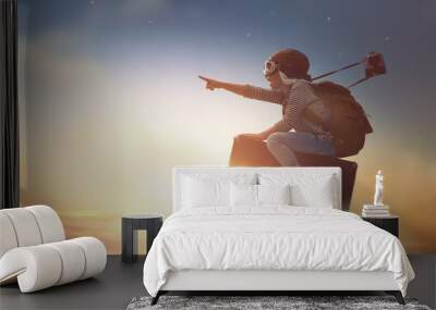 Child flying on a suitcase Wall mural