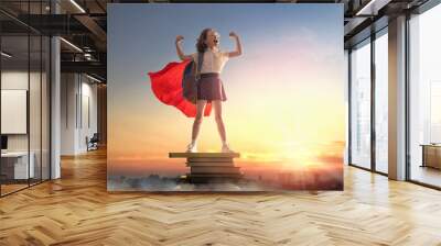 child on the tower of books Wall mural