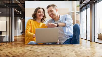 couple is using a laptop Wall mural