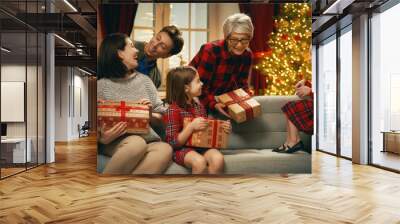 family celebrating Christmas Wall mural