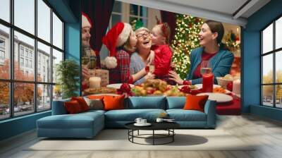 family celebrating Christmas Wall mural