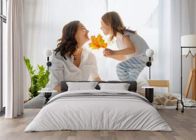 girl and mother enjoying sunny morning Wall mural