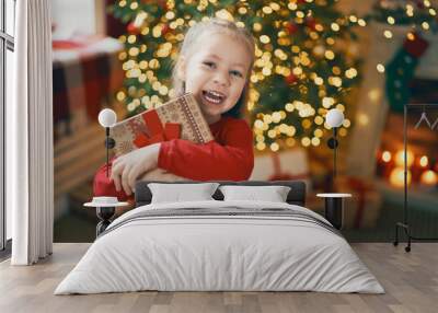 girl with Christmas gift. Wall mural