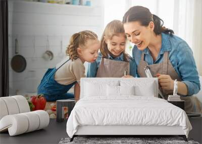 Happy family in the kitchen. Wall mural