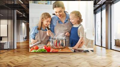 Happy family in the kitchen. Wall mural