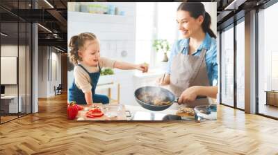 Happy family in the kitchen. Wall mural