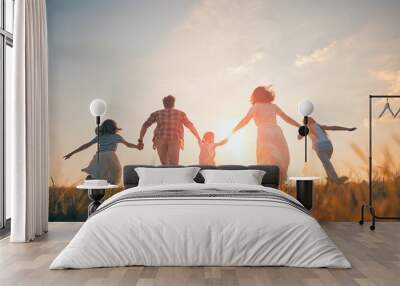 Happy family on autumn walk Wall mural